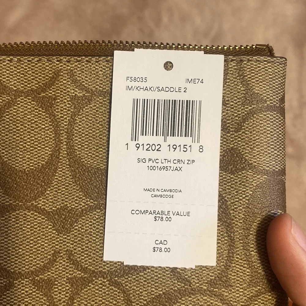 Brand new coach wristlet in brown signature canvas